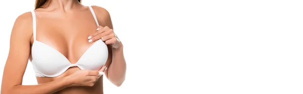 Vista recortada de la mujer en sujetador tocando pecho aislado en blanco, bandera — Stock Photo