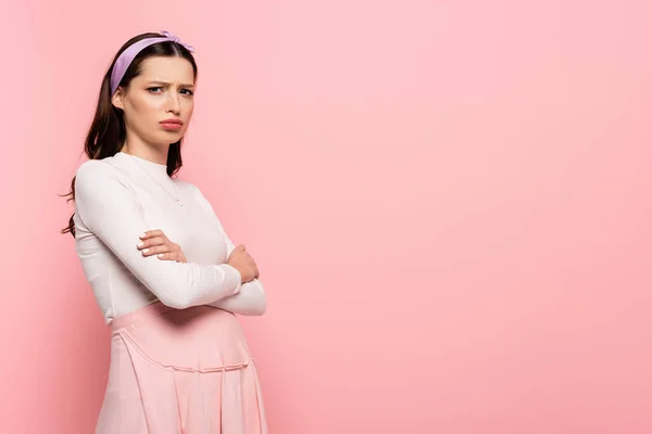 Sad young pretty pregnant woman isolated on pink — Stock Photo