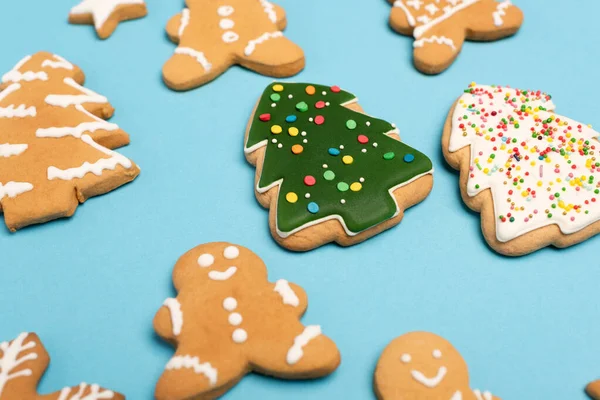 Winter gingerbread cookies on blue background — Stock Photo