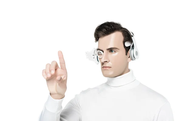 Cyborg man in headphones and digital eye lens pointing with finger isolated on white — Stock Photo