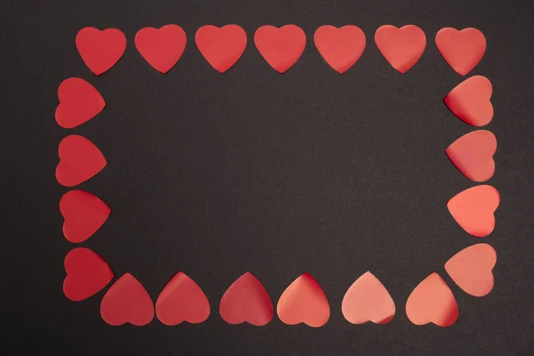 Top view of valentines frame of hearts isolated on black — Stock Photo