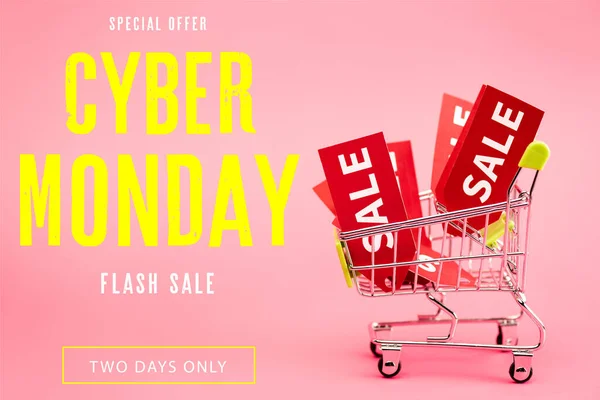 Red labels with sale in small shopping trolley near special offer, cyber monday lettering on pink — Stock Photo