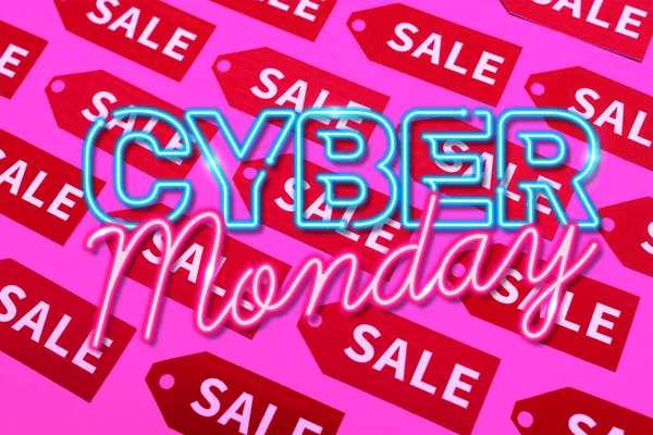 Top view of labels with sale near cyber monday lettering on pink, black friday concept — Stock Photo