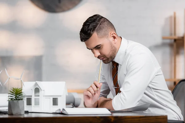 Thoughtful architect working on project in architectural agency — Stock Photo