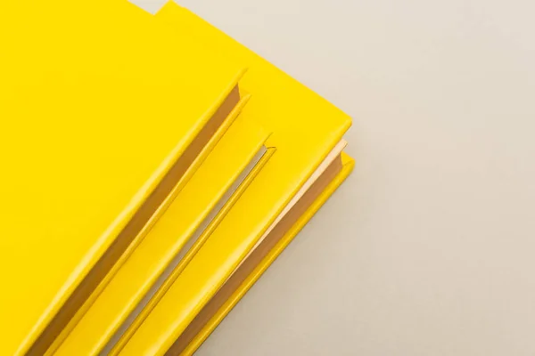 Yellow copy books isolated on grey with copy space — Stock Photo