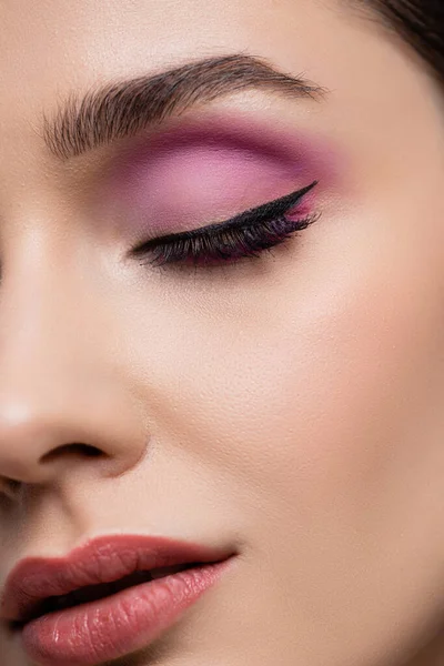 Close up of woman with pink eye shadows isolated on grey — Stock Photo