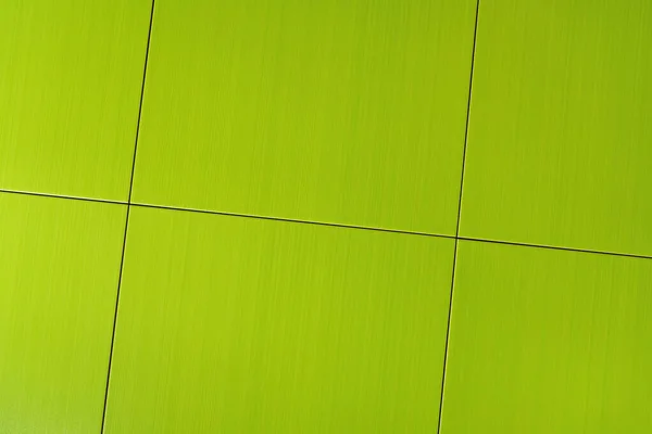 Background of bright, green square tiles, top view — Stock Photo