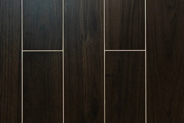Background of dark brown, rectangular tiles with wood surface imitation, top view — Stock Photo