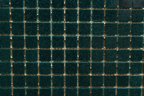 Background of dark green, small tiles, top view — Stock Photo