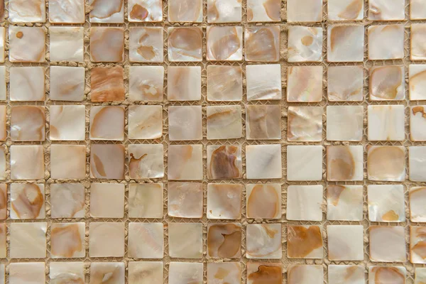 Nacreous beige tiles background, top view — Stock Photo