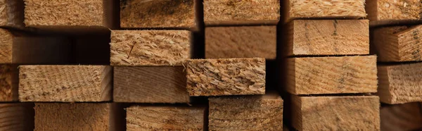 Background of natural, stacked hardwood boards, banner — Stock Photo