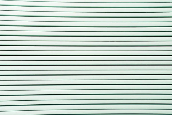Background of white horizontal rows of plastic elements, top view — Stock Photo