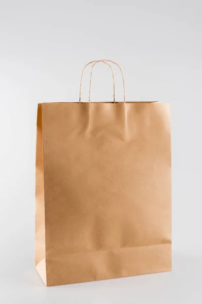Shopping bag made of paper on grey, ecology concept — Stock Photo