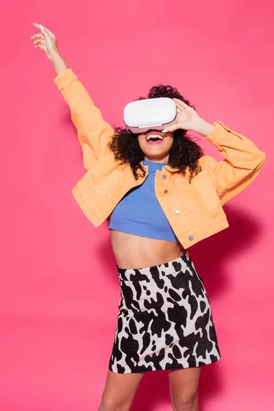 Smiling african american woman in vr headset on pink — Stock Photo