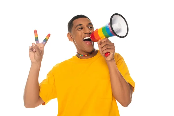 African american transgender man screaming in megaphone while showing peace sign isolated on white — Stock Photo