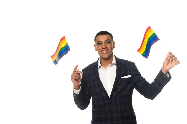 Happy african american businessman with makeup holding lgbt flags isolated on white — Stock Photo