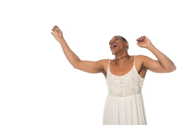 Laughing african american transgender man in sundress dancing isolated on white — Stock Photo