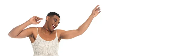 Happy african american transgender man in sundress dancing isolated on white, banner — Stock Photo