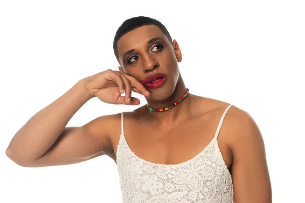 African american gay man in sundress touching face while looking away isolated on white — Stock Photo