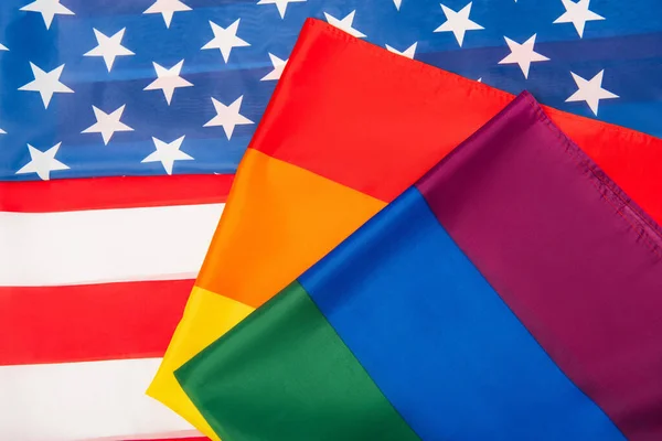 Top view of american and colorful lgbt flags — Stock Photo