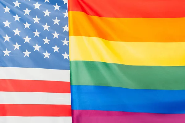 Close up of american and lgbt flags, equality rights concept — Stock Photo