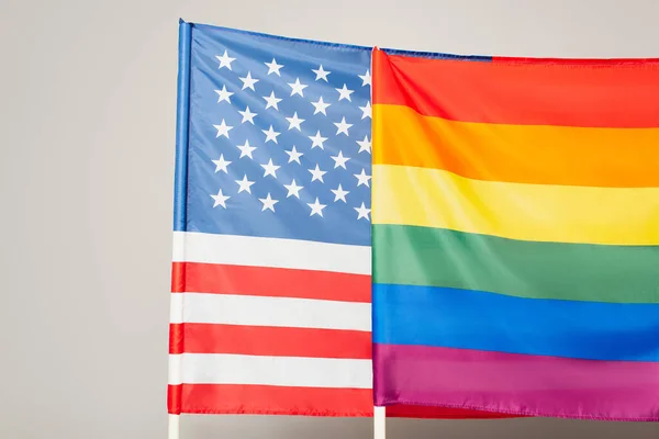 American and lgbt flags isolated on grey, equality rights concept — Stock Photo