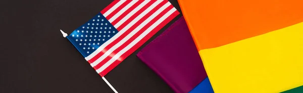 High angle view of american and lgbt flags isolated on black, banner — Stock Photo