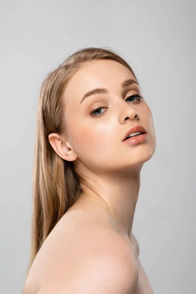 Young woman with bare shoulders isolated on grey — Stock Photo