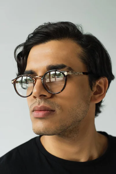 Portrait of stylish man in eyeglasses isolated on grey — Stock Photo
