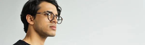 Stylish man in eyeglasses isolated on grey, banner — Stock Photo