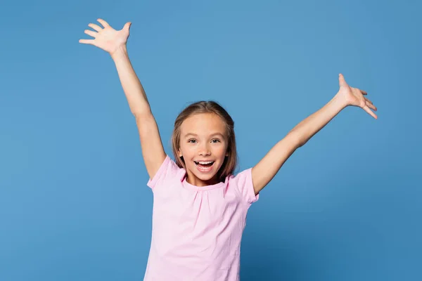 Happy kid looking at camera isolated on blue — Stock Photo