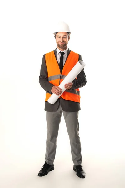 Engineer with blueprint smiling at camera on white background — Stock Photo