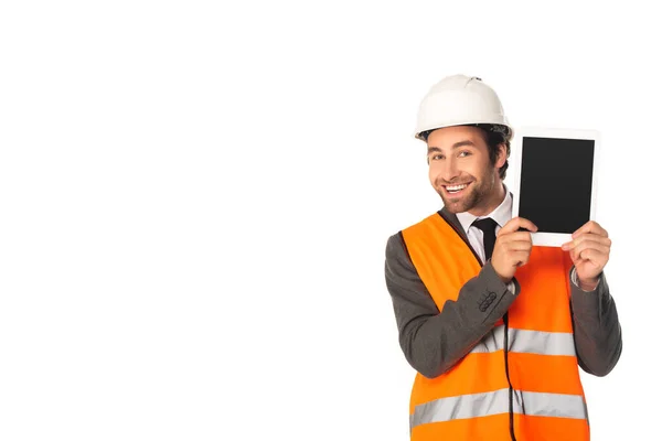 Positive engineer showing digital tablet and looking at camera isolated on white — Stock Photo