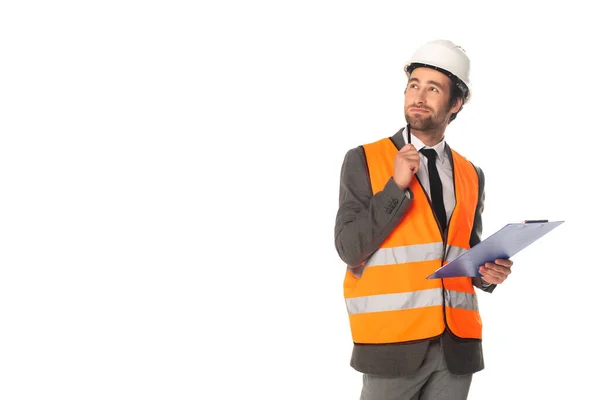 Pensive architect holding clipboard isolated on white — Stock Photo