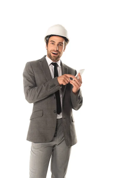 Excited engineer using smartphone isolated on white — Stock Photo