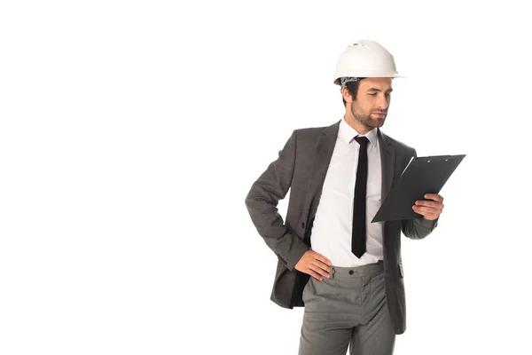 Engineer in hard hat holding clipboard isolated on white — Stock Photo