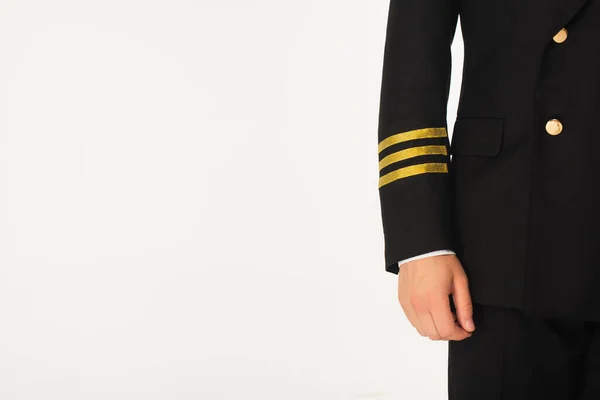 Vista ritagliata del pilota in uniforme isolato su bianco — Foto stock