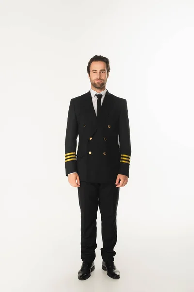 Young pilot looking at camera on white background — Stock Photo