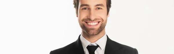 Giovane uomo d'affari che sorride alla telecamera isolata sul bianco, striscione — Foto stock
