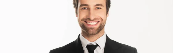 Joven hombre de negocios sonriendo a la cámara aislado en blanco, bandera - foto de stock