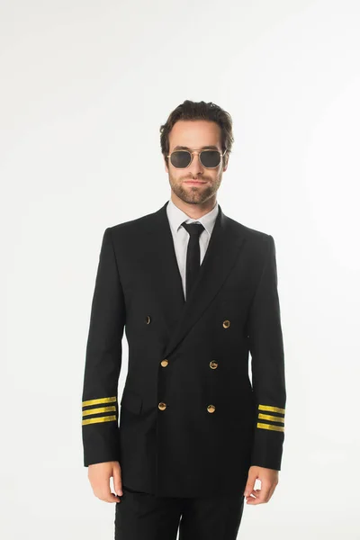 Pilot in uniform and sunglasses isolated on white — Stock Photo