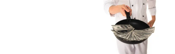 Cropped view of blurred chef holding frying pan with cash isolated on white, banner — Stock Photo