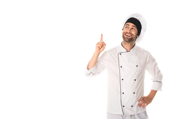 Chef sorrindo apontando com o dedo isolado no branco — Fotografia de Stock