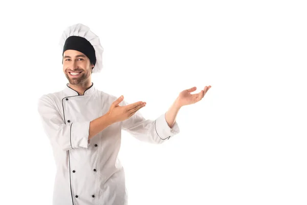 Cheerful chef pointing with hands isolated on white — Stock Photo