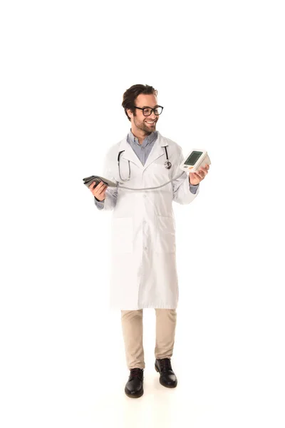 Cheerful doctor holding electronic tonometer on white background — Stock Photo