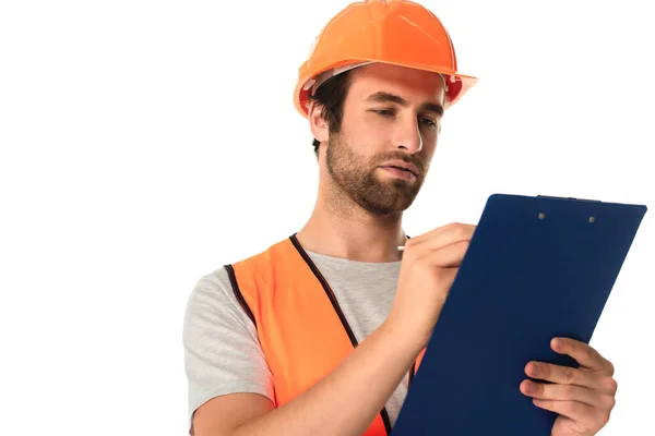 Repairman in hard hat writing on clipboard isolated on white — Stock Photo