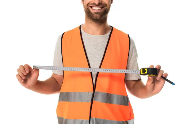 Cropped view of smiling builder holding tape measure isolated on white — Stock Photo