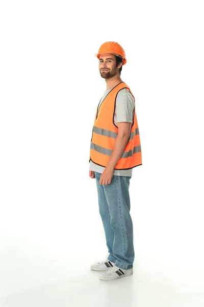 Volle Länge der junge Bauarbeiter Blick auf Kamera auf weißem Hintergrund — Stockfoto