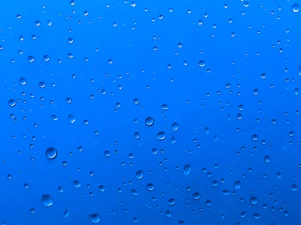 Oskärpa Vatten Droppe Glas Bakgrund Med Blå Färg — Stockfoto