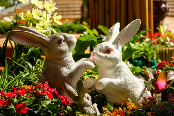 Handmade rabbit dolls on the flower background — Stock Photo, Image